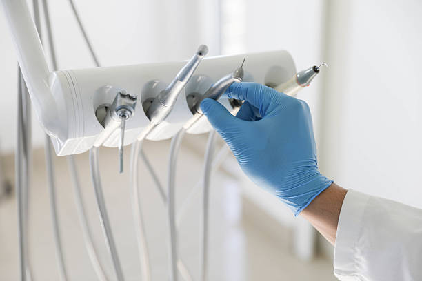 Professional Tooth Extraction technician working in Fort Bend County County, TX